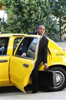 Business Man Exiting Taxi stock photo