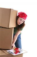 Woman Lifting Boxes stock photo