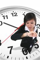 Business Woman on Clock stock photo