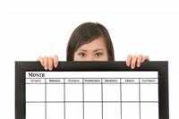 Woman Holding Calendar stock photo