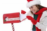 Woman Mailing Christmas Letter stock photo