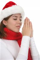 Girl Praying at Christmas stock photo
