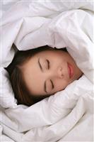 Girl in Blanket Sleeping stock photo