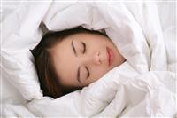 Girl in Blanket Sleeping stock photo