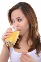 Woman Drinking Orange Juice stock photo