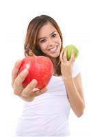 Pretty Woman Holding Apples stock photo