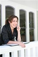 Woman on Phone at Home stock photo