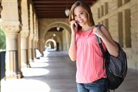 Pretty Girl on College Campus with Backpack stock photo