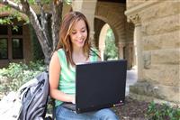 Cute Girl on Laptop at School stock photo