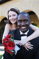 Attractive Man and Woman Interracial Wedding Couple stock photo
