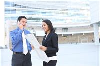 Man and Woman Business Team at Office Building stock photo