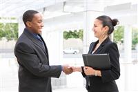 Man and Woman Business Team Handshake stock photo