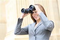 Business Woman with Binoculars stock photo
