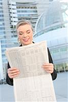 Pretty Business Woman Reading Newspaper stock photo