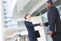 Diverse Business Man and Woman Handshake stock photo
