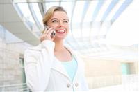 Pretty Blonde Business Woman on Cell Phone stock photo