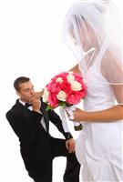Groom Kissing Bride at Wedding stock photo