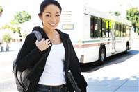 Pretty Asian Student Getting off Bus stock photo