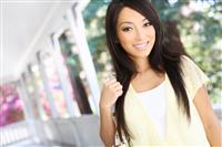 Pretty Asian  at home on Porch stock photo