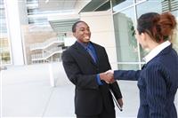 Diverse Business Man and Woman Handshake stock photo