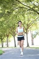 Pretty Woman Jogging in Park stock photo