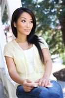 Pretty Asian at home on Porch stock photo