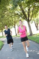 Attractive Man and Woman Couple Jogging stock photo