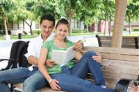 Attractive Teenage Students at College Reading stock photo