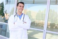 Handsome Smiling Doctor at Hospital stock photo