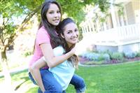 Attractive sisters having fun at Home stock photo