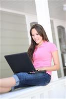 Pretty Girl Studying on Home Porch stock photo