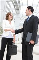 Man and Woman Business Team Handshake stock photo