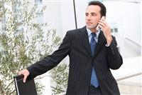 Handsome Business Man at Office on Phone stock photo