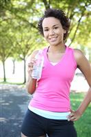 Jogger Drinking Water in Park stock photo