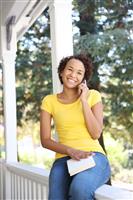 African American Woman on Porch stock photo