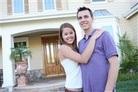 Couple in Love in Front of Home  stock photo