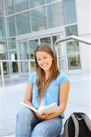 Attractive Woman Reading at School Library stock photo