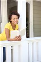 Pretty African Woman on Home Porch stock photo