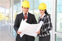Man and Woman Architects on Construction Site stock photo