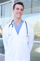 Handsome Smiling Doctor at Hospital stock photo