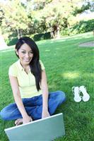 Asian Woman on Laptop Computer stock photo