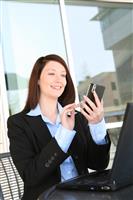 Pretty Woman Texting at Work stock photo