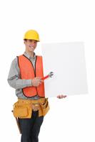 Handsome Construction Man with Sign stock photo