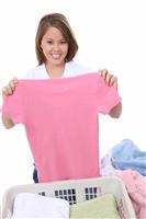 Pretty Woman Folding Clothes stock photo