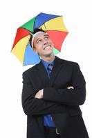 Business Man Under Umbrella stock photo