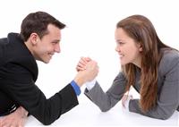 Man and Woman Arm Wrestling stock photo