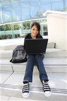 Asian Girl on Laptop at School stock photo