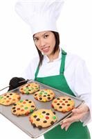 Woman Chef with Cookies stock photo