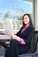 Asian Business Woman Reading Newspaper stock photo
