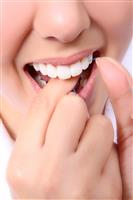 Woman Flossing Her Teeth stock photo